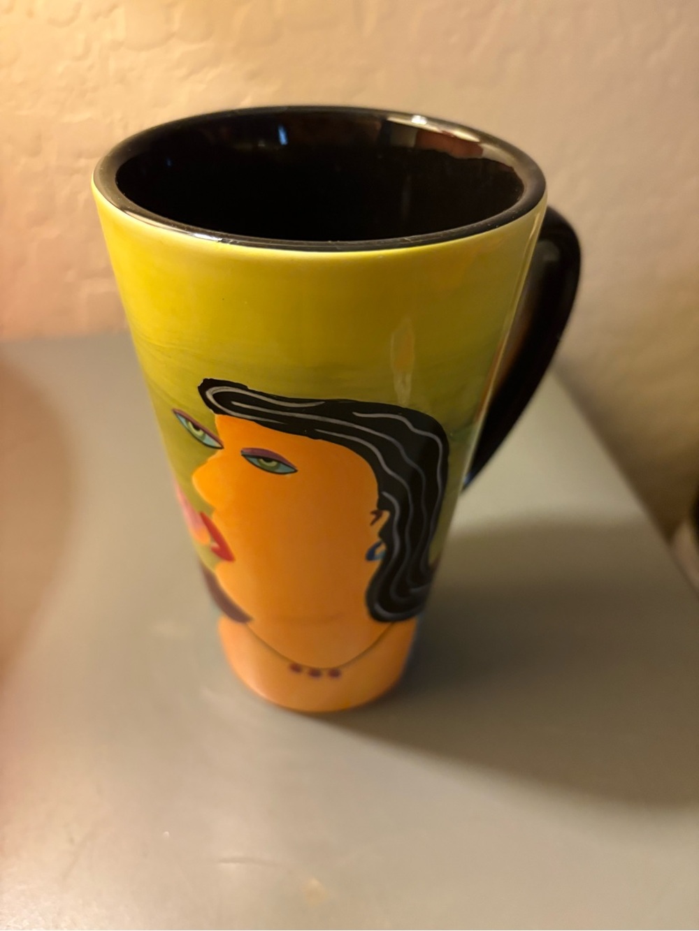 NYLORA Yellow Ceramic Mug with Abstract Face and Black Interior